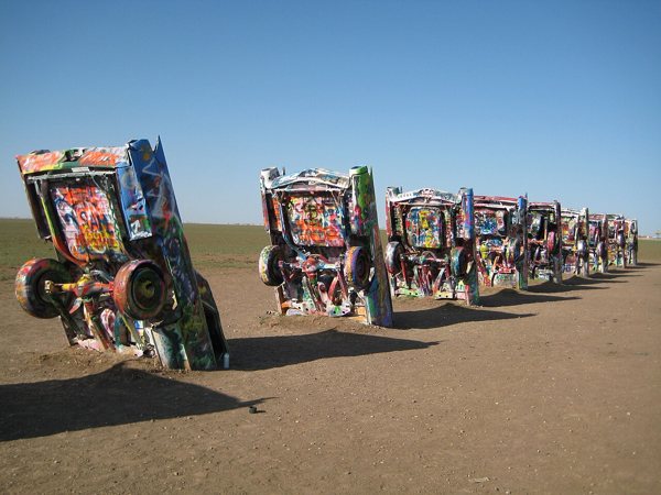 Colorfully painted Cadillacs planted nose-first at Cadillac Ranch