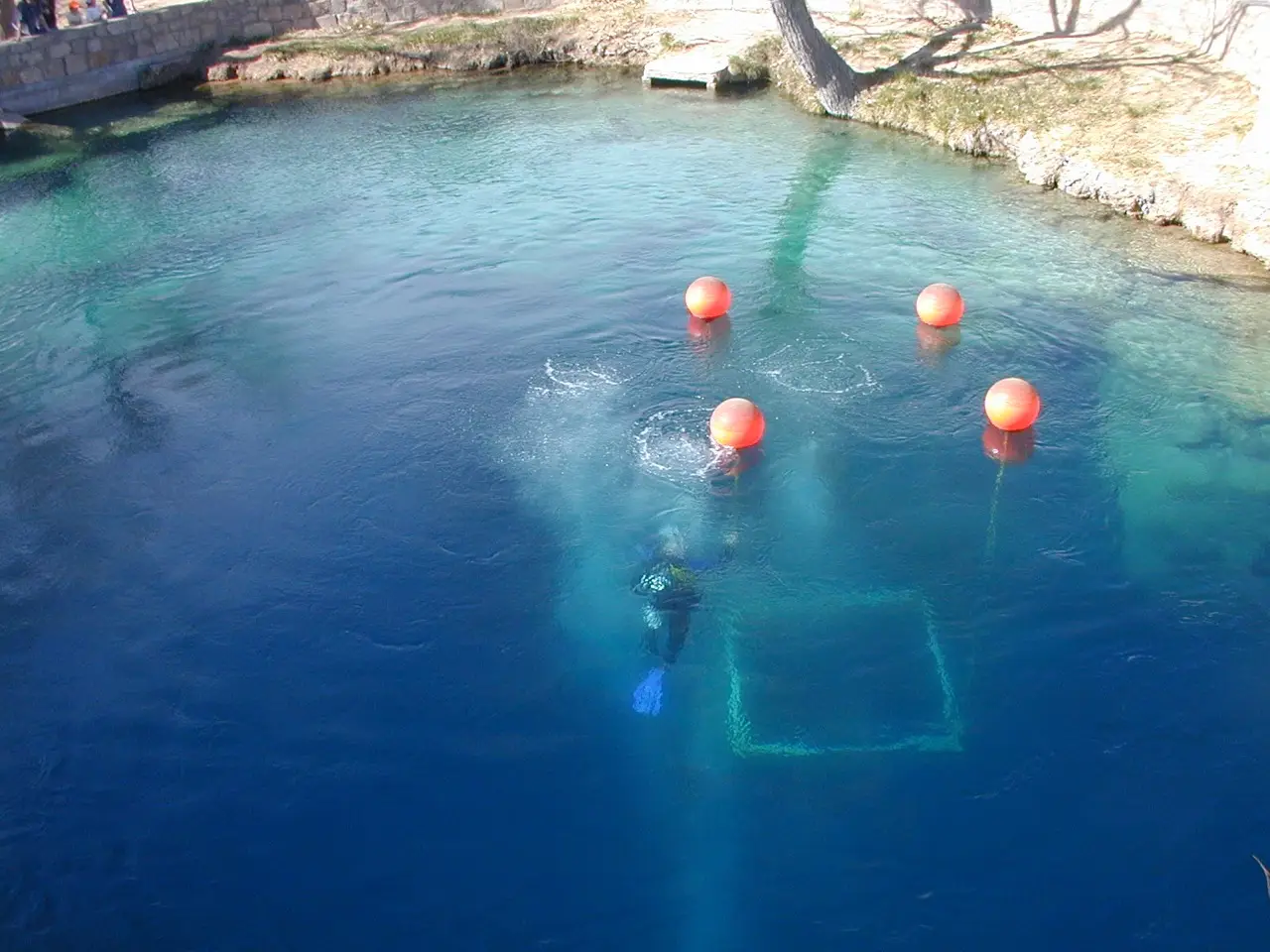 A scuba diver in the clear water of the Blue Hole in Santa Rosa