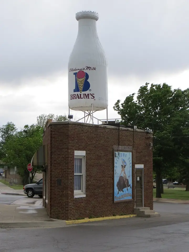 The Milk Bottle Grocery, a small triangular store with a giant milk bottle on its roof, on Classen Boulevard in Oklahoma City