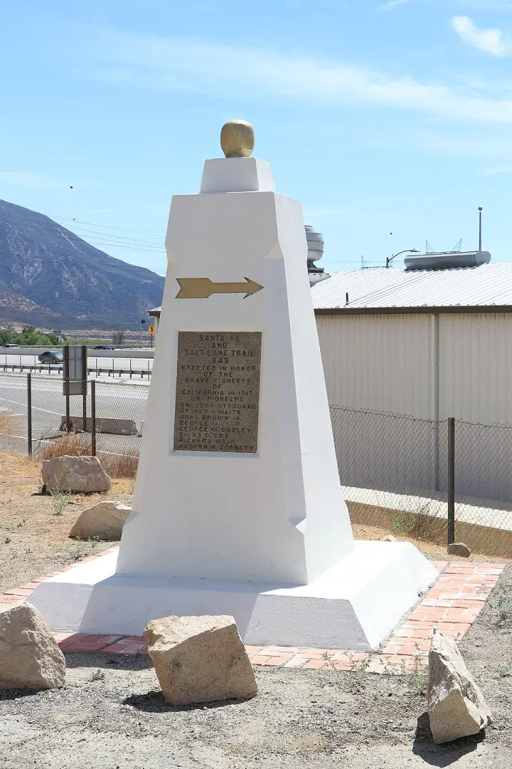 The white 1917 Santa Fe and Salt Lake Trail Monument in Cajon Canyon
